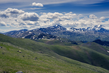 Fantastic mountain scenery - low clouds are floating in a deep blue sky