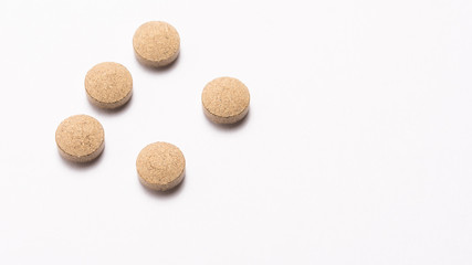 Pills on white background