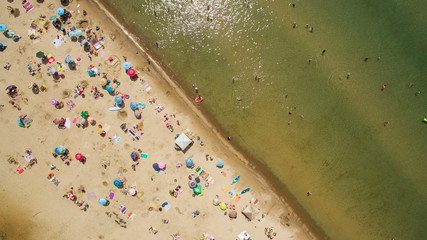 Fototapeta na wymiar People enjoy the sandy beach at Sauble Beach, Ontario, Canada