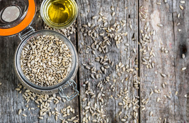 Sunflower oil from sunflowers seeds, vegan food concept, top view