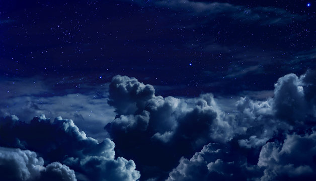 Fototapeta beautiful starry night sky with large clouds