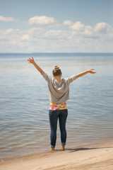 Beautiful girl near the water