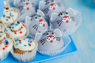 Blue and white cup cake on a blue background