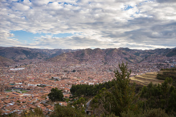 Fototapeta na wymiar Expansive cityscape of Cusco town with scenic cloudscape. Cusco is among the most important travel destination in Peru and the entire South America.