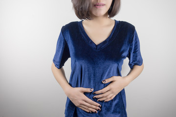 Young beautiful asian woman having painful stomachache.