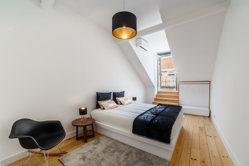 Modern apartment with white walls and light wooden floor