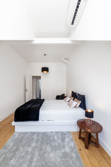 Modern apartment with white walls and light wooden floor