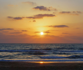 Reflection of the setting sun in sea water