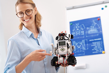 Joyful scientist representing the automatic robot in the laboratory
