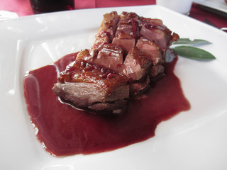 Duck breast on Sangiovese red wine sauce . Duck chest italian recipe
