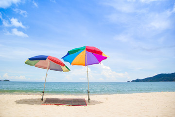 Chairs and umbrella in  beach - tropical holiday.