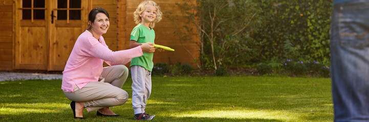 Mother and son playing frisbee