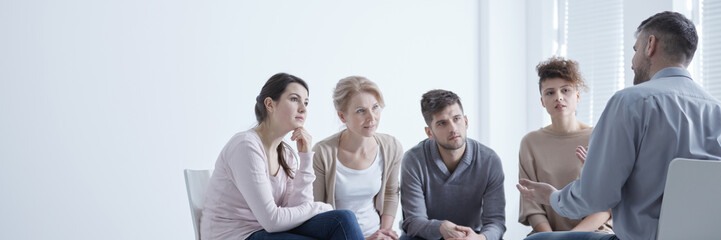 Man confiding problems in support group