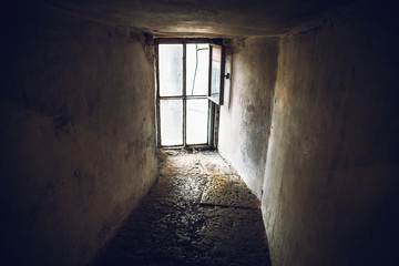 Fototapeta na wymiar Dark empty corridor and large window on the whole wall
