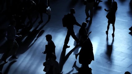 pedestrians walking on crowded street. crowds of people commuting background 