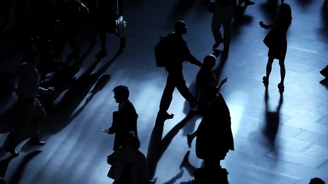 pedestrians walking on crowded street. crowds of people commuting background 