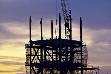 Silhouette construction site background .