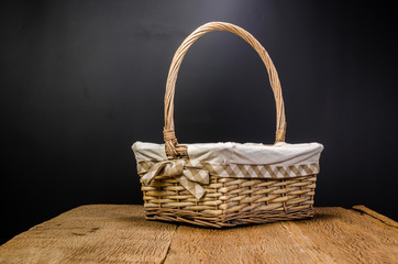 wicker basket on wooden table - 163933270