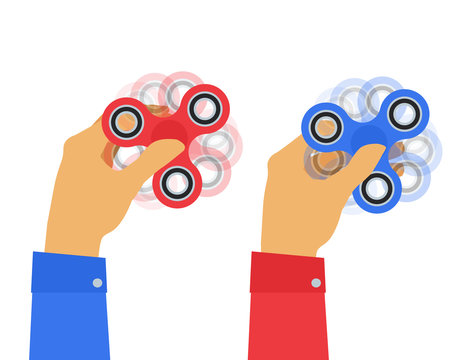 two human hands holding fidget spinners on white background
