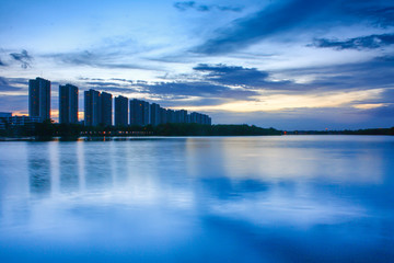 city scape at night with reflection on lake. Thailand. sunset with sky. small lake in city.