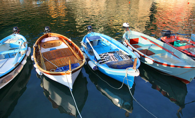 Fototapeta na wymiar Colorful boats in the Vernazza Harbor in Cinque Terre