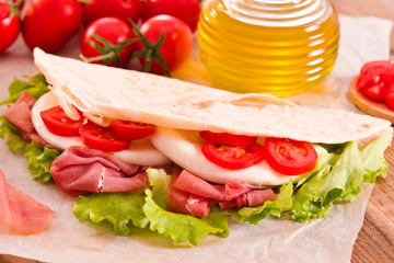 Piadina with ham and lettuce. 