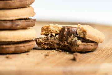 Round chocolate cookies on the wooden board