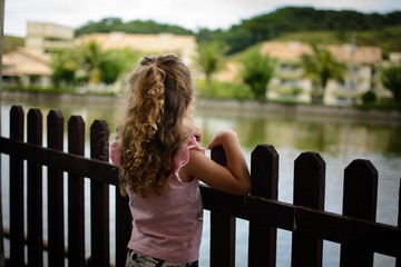 Girl starring at a lake