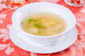 Fish soup in white plate