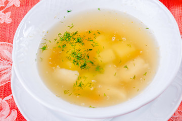 Fish soup in white plate