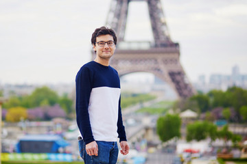 Man in Paris in front of the Eiffel tower