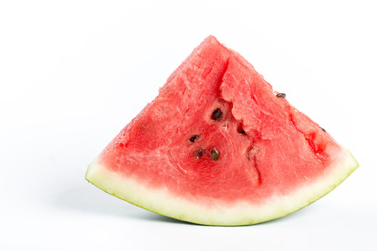 Slices of watermelon isolated above white background