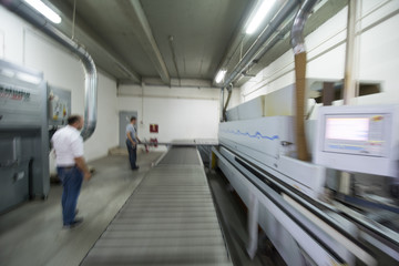 Obraz premium workers in a factory of wooden furniture