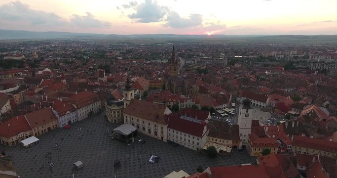Sibiu, Romania at sunset. Aerial footage over the main city square