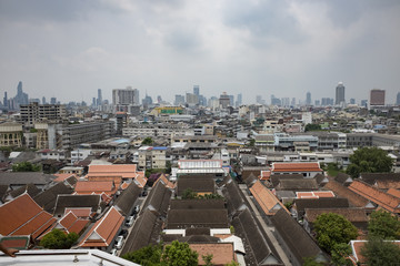 Panorama view of Bangkok from Golden Mountain on sunset cloudy sky, Thailand. Traditional architecture of Bangkok from the height of bird flight.