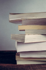 The book is on a wooden table with filter effect retro vintage style