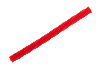 A single red spiral licorice stick isolated on a white background. - 163944424