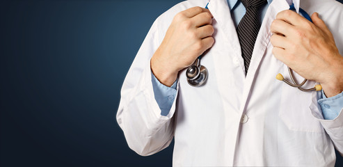 Healthcare and Medicine concept. Unrecognizable Male Doctor Holds Hands On Stethoscope
