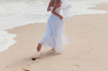 Groom`s and bride`s feet on the beach