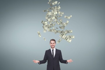 Happy business man with money rain against blue background