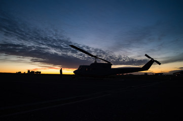 Silhouette of a UH1H Huey helicopter during sunset © Gonzalo Solari