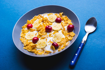 Bowl of cereal for breakfast on a blue background