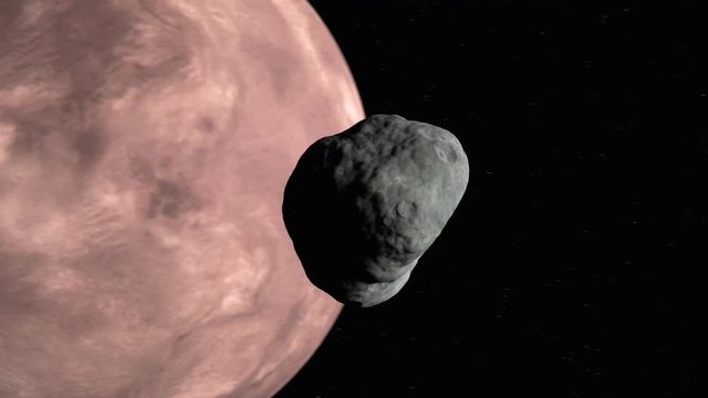 An asteroid is passing by and almost colliding with Mars moon Phobos
