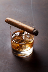 Whiskey with ice and cigar