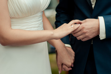 Fototapeta na wymiar Holding hands. Closeup view of married couple holding hands