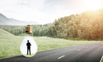 Businessman inside light bulb