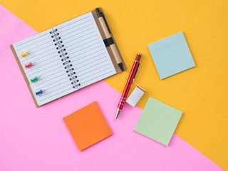 Flat Lay Stationary on Pink and yellow background