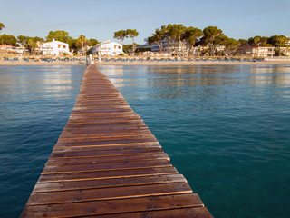 Fototapeta na wymiar Playa de Muro, Mallorca, Balearic islands. Beatiful wooden boards pier