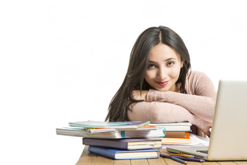 Female student in exams with books