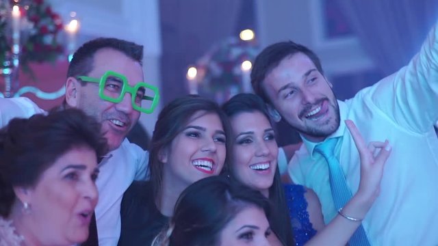 Family taking a selfie in a wedding